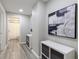 Hallway with art leading to the bathroom at 6185 Deerwoods Trl, Alpharetta, GA 30005