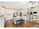 Bright, spacious kitchen features an island, stainless steel appliances, and hardwood floors at 6185 Deerwoods Trl, Alpharetta, GA 30005