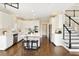 Spacious open-concept kitchen with a center island, stainless appliances, and hardwood flooring at 6185 Deerwoods Trl, Alpharetta, GA 30005
