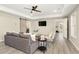 Cozy living room with modern furniture, coffered ceiling, barn door, and recessed lighting at 6185 Deerwoods Trl, Alpharetta, GA 30005