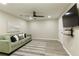 Comfortable living room with sofa, TV, and stylish decor at 6185 Deerwoods Trl, Alpharetta, GA 30005