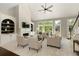 Bright living room with fireplace, built-in shelves, and comfortable seating area at 6185 Deerwoods Trl, Alpharetta, GA 30005