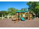 Community playground featuring slides, swings, and climbing structures at 6185 Deerwoods Trl, Alpharetta, GA 30005