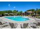Large community pool with plenty of lounge chairs and shaded areas at 6185 Deerwoods Trl, Alpharetta, GA 30005