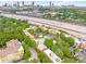 Aerial view of buildings, green trees, a pool, parking areas, and the skyline at 791 Wylie Se St # 709, Atlanta, GA 30316