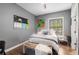 Bedroom boasts a window view, hardwood flooring, and modern accents for a relaxing retreat at 791 Wylie Se St # 709, Atlanta, GA 30316