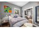Bedroom boasts a window view, hardwood flooring, and modern accents for a relaxing retreat at 791 Wylie Se St # 709, Atlanta, GA 30316