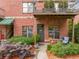Inviting brick exterior with a cozy patio and lush, mature landscaping at 791 Wylie Se St # 709, Atlanta, GA 30316