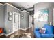 Hallway features hardwood floors, gray walls, and decorative accents for a stylish and welcoming transition space at 791 Wylie Se St # 709, Atlanta, GA 30316