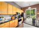 Bright kitchen features wooden cabinets, granite counters, and stainless steel appliances at 791 Wylie Se St # 709, Atlanta, GA 30316