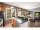 Open kitchen featuring modern appliances, granite countertops and brick wall accents at 791 Wylie Se St # 709, Atlanta, GA 30316