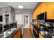Well-equipped kitchen with stainless steel appliances, a breakfast bar and granite counters at 791 Wylie Se St # 709, Atlanta, GA 30316