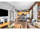 Open-concept living space with hardwood floors, a kitchen island, and comfortable sofa at 791 Wylie Se St # 709, Atlanta, GA 30316