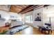 Bright bedroom features a wooden ceiling, hardwood floors, and large window at 1661 La France Ne St # 221, Atlanta, GA 30307