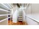 Unique closet features custom storage and a rolling ladder for accessibility at 1661 La France Ne St # 221, Atlanta, GA 30307