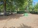 Community dog park featuring green space, a bench, and shade trees for outdoor enjoyment at 1661 La France Ne St # 221, Atlanta, GA 30307