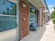 Charming brick exterior with sidewalk access and outdoor seating. Building is numbered 221 at 1661 La France Ne St # 221, Atlanta, GA 30307