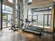 Bright fitness center featuring a treadmill and exercise machines, with a view of the outdoors at 1661 La France Ne St # 221, Atlanta, GA 30307