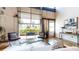 Contemporary living space with exposed brick, high ceilings, and large windows at 1661 La France Ne St # 221, Atlanta, GA 30307