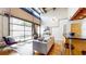 Spacious living room with large windows and a partial view of the kitchen at 1661 La France Ne St # 221, Atlanta, GA 30307