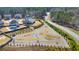 Aerial view of neighborhood recreation space featuring pea gravel walking paths, seating, and picnic tables at 197 Hickory Pointe Dr, Acworth, GA 30101