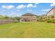 Spacious backyard featuring a well-maintained lawn and a covered patio for outdoor relaxation and entertainment at 197 Hickory Pointe Dr, Acworth, GA 30101