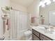 Bathroom with a shower and shelves, featuring a dark-wood vanity at 197 Hickory Pointe Dr, Acworth, GA 30101