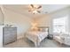 Bedroom with ceiling fan, neutral decor and light gray dresser at 197 Hickory Pointe Dr, Acworth, GA 30101