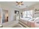 Cozy bedroom with a ceiling fan, window, and nearby ensuite at 197 Hickory Pointe Dr, Acworth, GA 30101