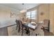 Bright dining room features stylish chandelier, seating for six, and elegant decor at 197 Hickory Pointe Dr, Acworth, GA 30101