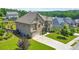 Beautiful two-story home showcasing a manicured lawn, mature trees, and an attached two-car garage at 197 Hickory Pointe Dr, Acworth, GA 30101