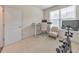 Bright office space featuring a standing desk, modern lighting, a large window, and an exercise bike at 197 Hickory Pointe Dr, Acworth, GA 30101