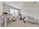 Bright office space featuring a standing desk, modern lighting, a large window, and an exercise bike at 197 Hickory Pointe Dr, Acworth, GA 30101