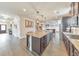 Open kitchen featuring a large island with seating and stainless steel appliances at 197 Hickory Pointe Dr, Acworth, GA 30101