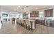 Gourmet kitchen features granite counters, dark wood cabinets, and stainless steel appliances at 197 Hickory Pointe Dr, Acworth, GA 30101