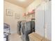 Convenient laundry room with front-loading washer, dryer, and storage at 197 Hickory Pointe Dr, Acworth, GA 30101