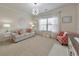 Cozy living room featuring a neutral color palette, decorative lighting, a large window, and comfortable seating at 197 Hickory Pointe Dr, Acworth, GA 30101