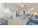 Bright living room with large windows, neutral carpeting, a modern chandelier, and open floor plan at 197 Hickory Pointe Dr, Acworth, GA 30101