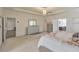 Spacious main bedroom suite featuring tray ceiling, large windows and ensuite bathroom access at 197 Hickory Pointe Dr, Acworth, GA 30101