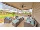 Back patio with lounge furniture and a beautifully landscaped backyard at 197 Hickory Pointe Dr, Acworth, GA 30101