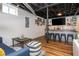 Basement with bar area, seating and exposed ceiling and ductwork that offers a modern, industrial feel at 2681 Linnwood Se Dr, Smyrna, GA 30080
