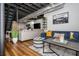 Finished basement with seating and stairs has a large seating area, tv, exposed ceiling, and duct work at 2681 Linnwood Se Dr, Smyrna, GA 30080