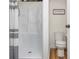 Clean bathroom with a white shower stall, matching toilet, and neutral wall color at 2681 Linnwood Se Dr, Smyrna, GA 30080