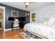 Comfortable bedroom with hardwood floors, a ceiling fan, desk, and chair perfect for working or relaxing at 2681 Linnwood Se Dr, Smyrna, GA 30080