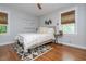 Serene bedroom with hardwood floors, neutral tones, and a geometric rug for a calming retreat at 2681 Linnwood Se Dr, Smyrna, GA 30080