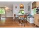 Bright dining area with hardwood floors and a built-in bench is perfect for enjoying meals and gatherings at 2681 Linnwood Se Dr, Smyrna, GA 30080