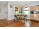 Well-lit dining area features hardwood floors, a built-in bench, and natural light, perfect for meals and entertaining at 2681 Linnwood Se Dr, Smyrna, GA 30080