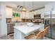 Modern kitchen with white cabinets, stainless steel appliances, and an island is designed for both function and style at 2681 Linnwood Se Dr, Smyrna, GA 30080