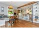 Spacious kitchen with hardwood flooring, breakfast nook, bright white cabinets and stainless steel refrigerator at 2681 Linnwood Se Dr, Smyrna, GA 30080