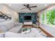 Inviting living room with a large grey sectional sofa, modern decor, and natural light from large window at 2681 Linnwood Se Dr, Smyrna, GA 30080